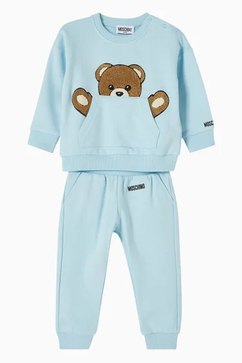 BG SWEATSHIRT TEDDY BEAR PEEKING OUT OF THE KANGAROO POCKET, PAIRED WITH MATCHING JOGGERS.:Light/Pastel Blue:12-18M|219854876