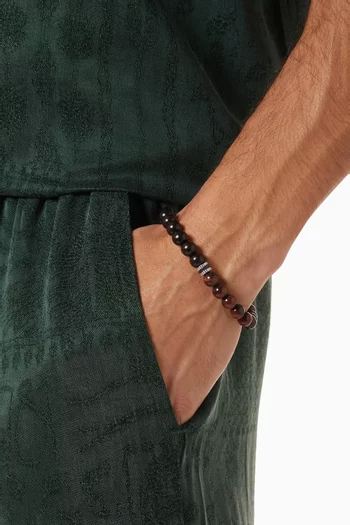 سوار بخرز من أحجار شبه ثمينة وحلي على شكل تروس