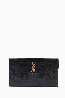 Uptown croc store embossed leather clutch