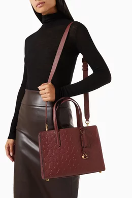 Coach charlie carryall 28 oxblood store