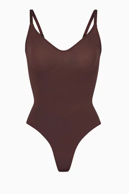 Skims Seamless Sculpt Low Back Thong Bodysuit In Brown