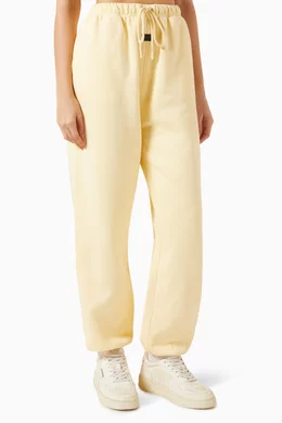 Fear of god essentials sales sweatpants yellow