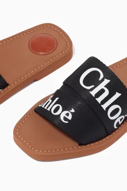 Buy Chloé Black Woody Logo Slides in Canvas For Women Online