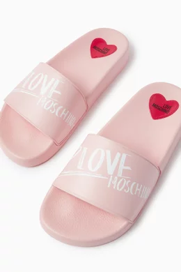 Buy Love Moschino Pink All over Logo Flat Slides in Rubber For Women Online Ounass Saudi