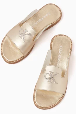 Buy Calvin Klein Gold Logo Slip on Sandals in Metallic leather For Girls Online Ounass Saudi