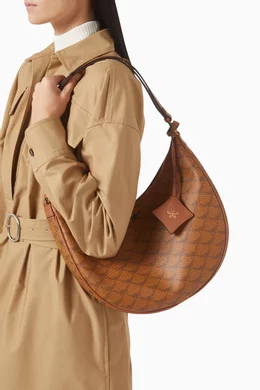 Buy MCM Brown Himmel Ascending Moon Hobo Bag in Lauretos