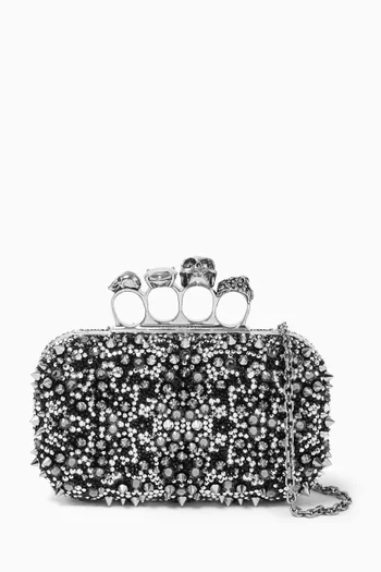 Skull Embellished Four-ring Clutch in Leather