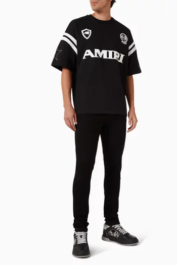 بنطال جينز بقصة سكيني وحلية شعار الماركة دينم