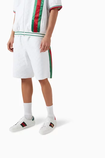 سنيكرز إيس أسفل الكاحل مزين بتطريز جلد