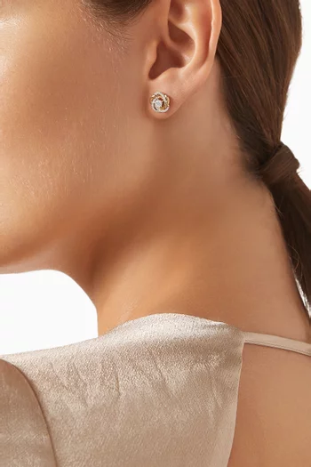 أقراط بتصميم حلزوني مرصعة بالماس ذهب عيار 18