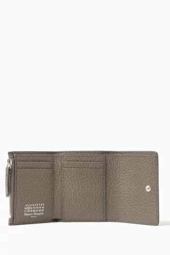 محفظة بشعار الأربع غرز جلد