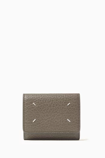 محفظة بشعار الأربع غرز جلد