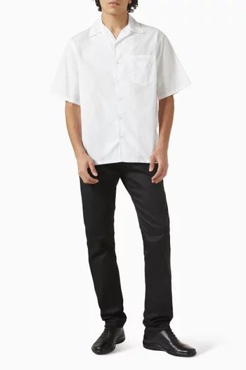 بنطال جينز بقصة تضيق باتجاه الحافة دريل مطاطي