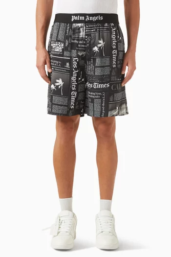 شورت برمودا بنقشة صحف