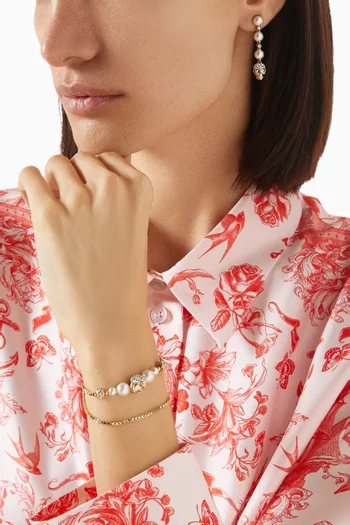 سوار مزين بلؤلؤ وحلية بتصميم جمجمة نحاس بلون ذهبي