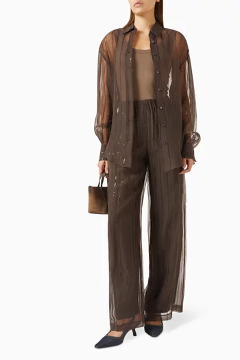 بنطال بقصة ساق واسعة وأشرطة مطرزة بالترتر