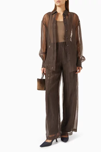 بنطال بقصة ساق واسعة وأشرطة مطرزة بالترتر