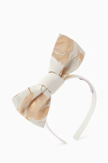 طوق رأس مزين بعقدة بتصميم أوريغامي