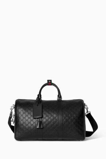 حقيبة دفل متوسطة بشعار حرفي GG جلد