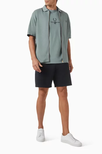 تي شيرت بولو بارز الملمس بسحّاب قطن