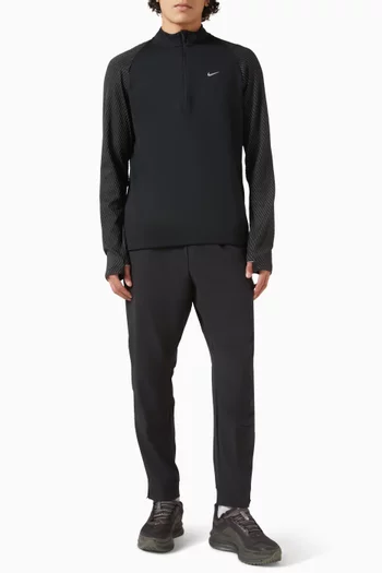 تي شيرت بتصميم عاكس للضوء وسحّاب قصير بتقنية Dri-FIT‏