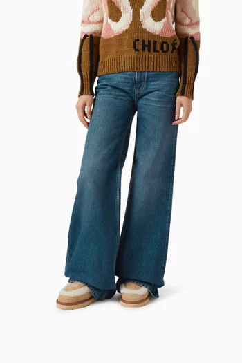 حذاء بوت دولسي بطول الكاحل مزين بفرو شمواه