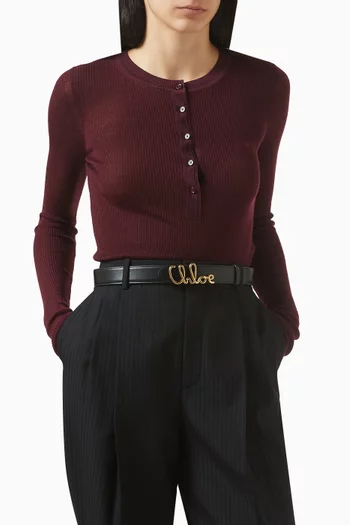 حزام بشعار الماركة جلد