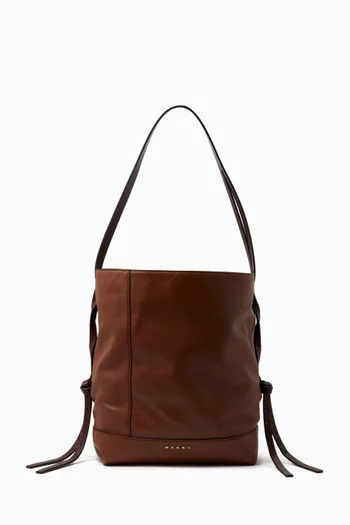 حقيبة ساك بشعار الماركة جلد