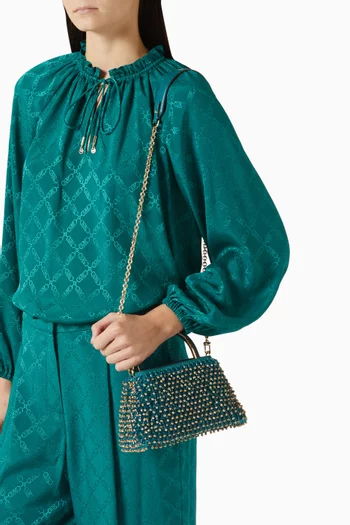 حقيبة كتف ميني بيد علوية جلد مزين بالخرز إصدار حصري للشرق الأوسط 