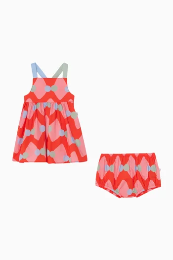 فستان بحمالات متقاطعة في الخلف ونقشة خطوط متعرجة