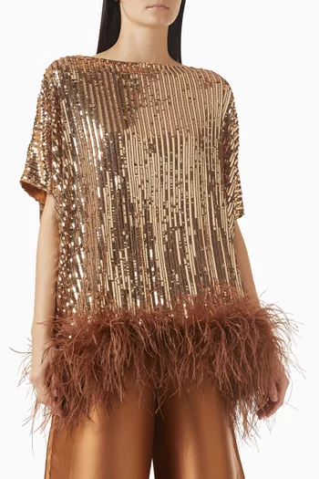 بلوزة بقصة واسعة مزينة بتطريزات بالترتر