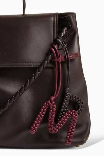 حلية بتصميم حرف O جلد نابا مجدول