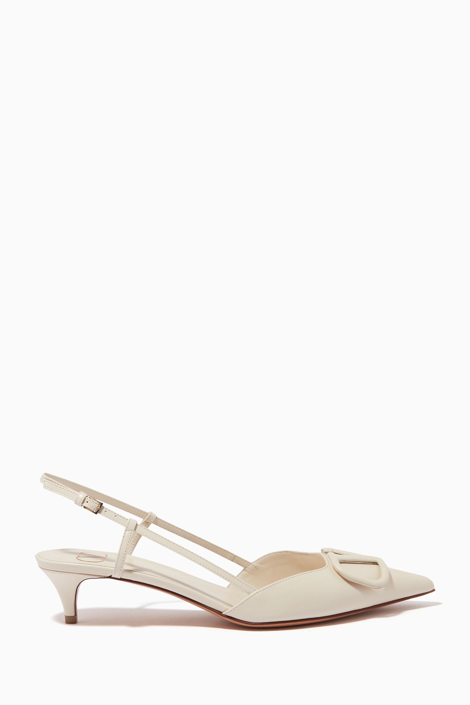 White patent outlet leather pumps