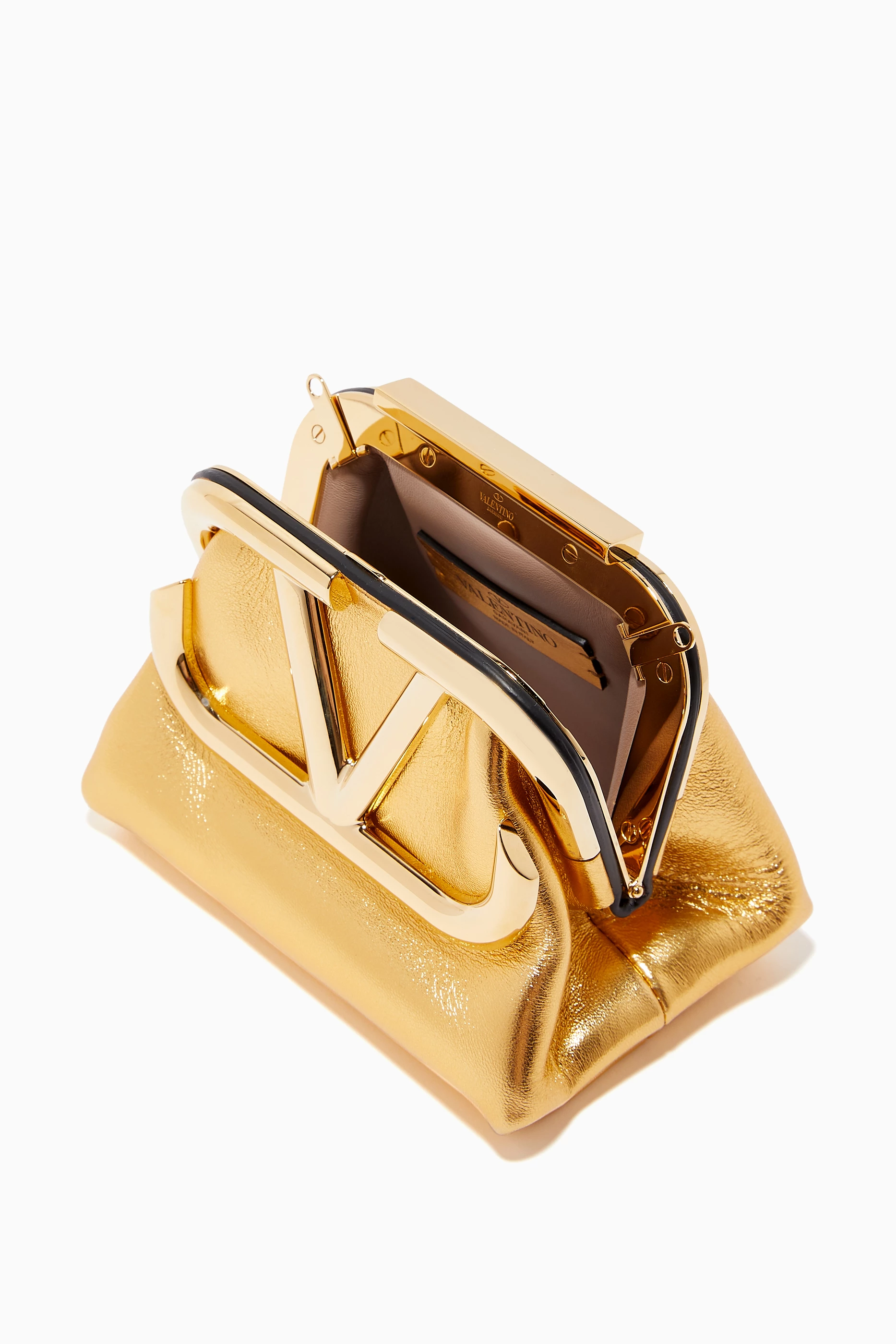 Buy Valentino Garavani Gold Valentino Garavani Supervee Clutch Bag in Metallic Nappa For Women Online Ounass Saudi