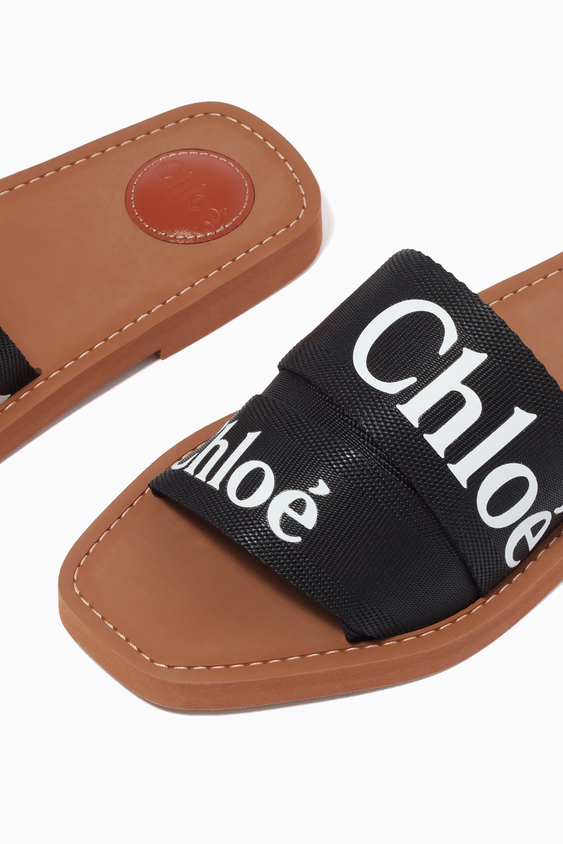 Buy Chloé Black Woody Logo Slides in Canvas For Women Online