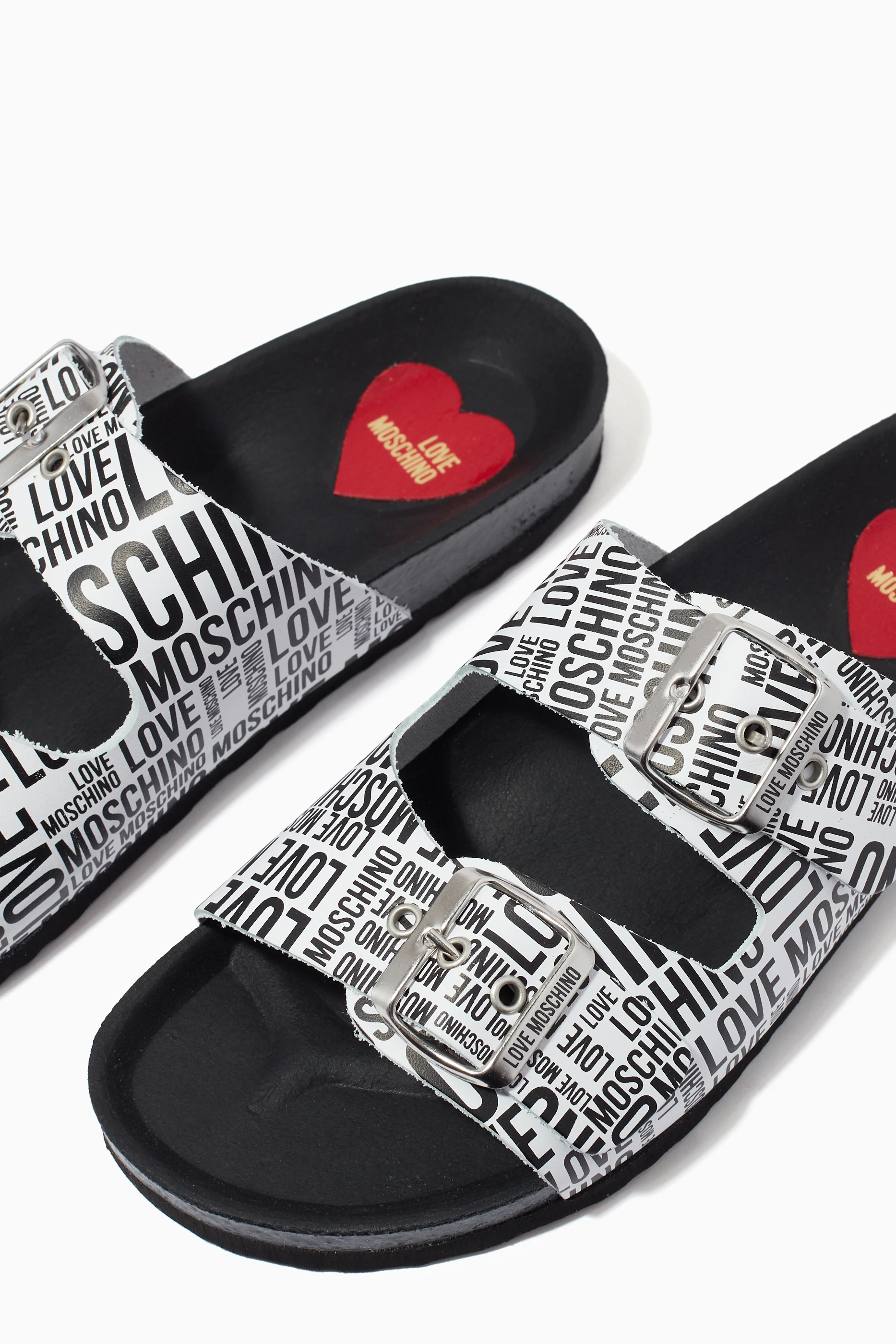 Buy Love Moschino White Slide Sandals in All over Logo Leather For Women Online Ounass Saudi