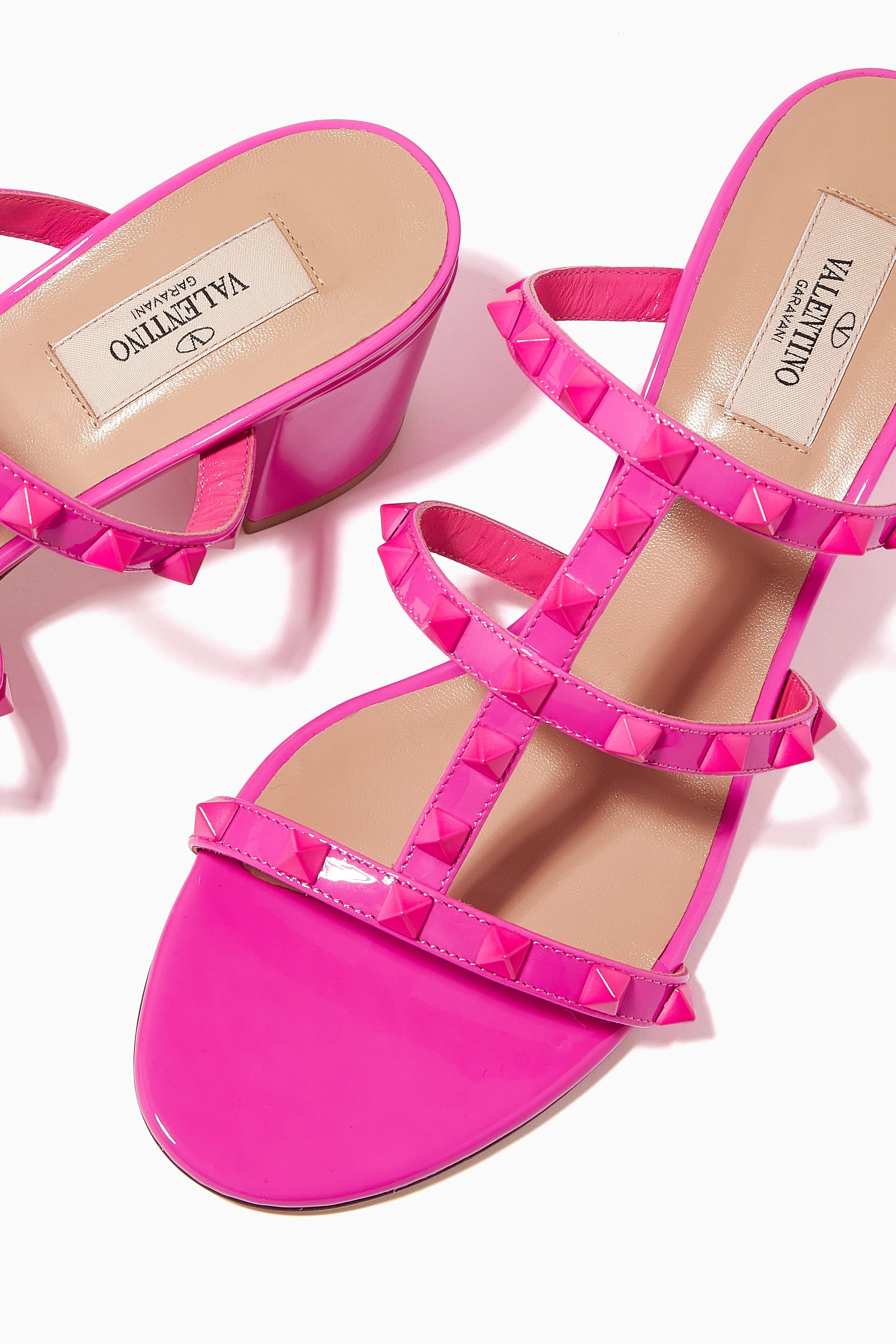Buy Valentino Garavani Pink Valentino Garavani Rockstud Mule Sandals in Patent Leather For Women Online Ounass Saudi