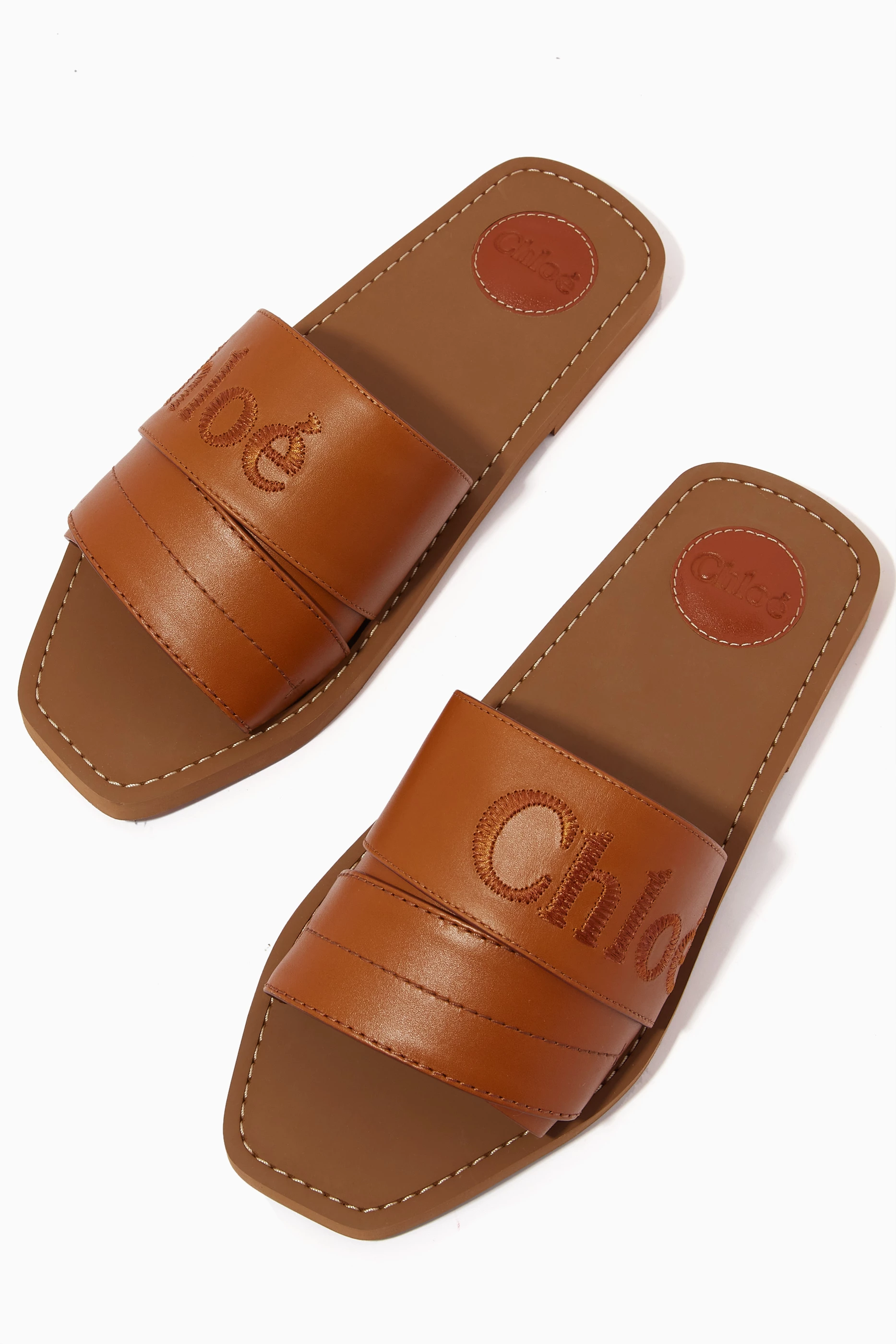 Buy Chloé Brown Woody Logo Slide Sandals in Calfskin For Women