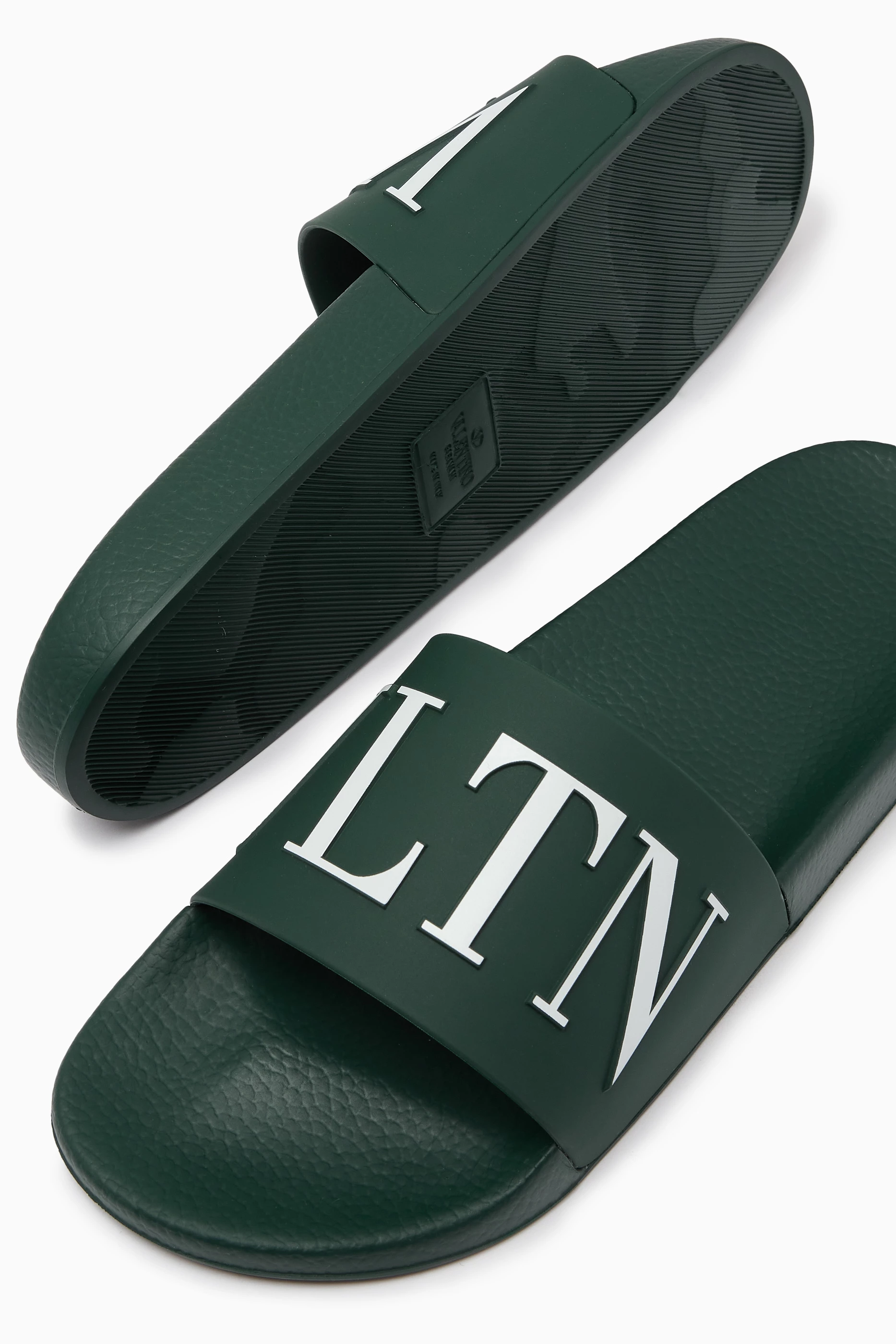 Buy Valentino Garavani Green Valentino Garavani VLTN Slide Sandals in Rubber For Men Online Ounass Saudi