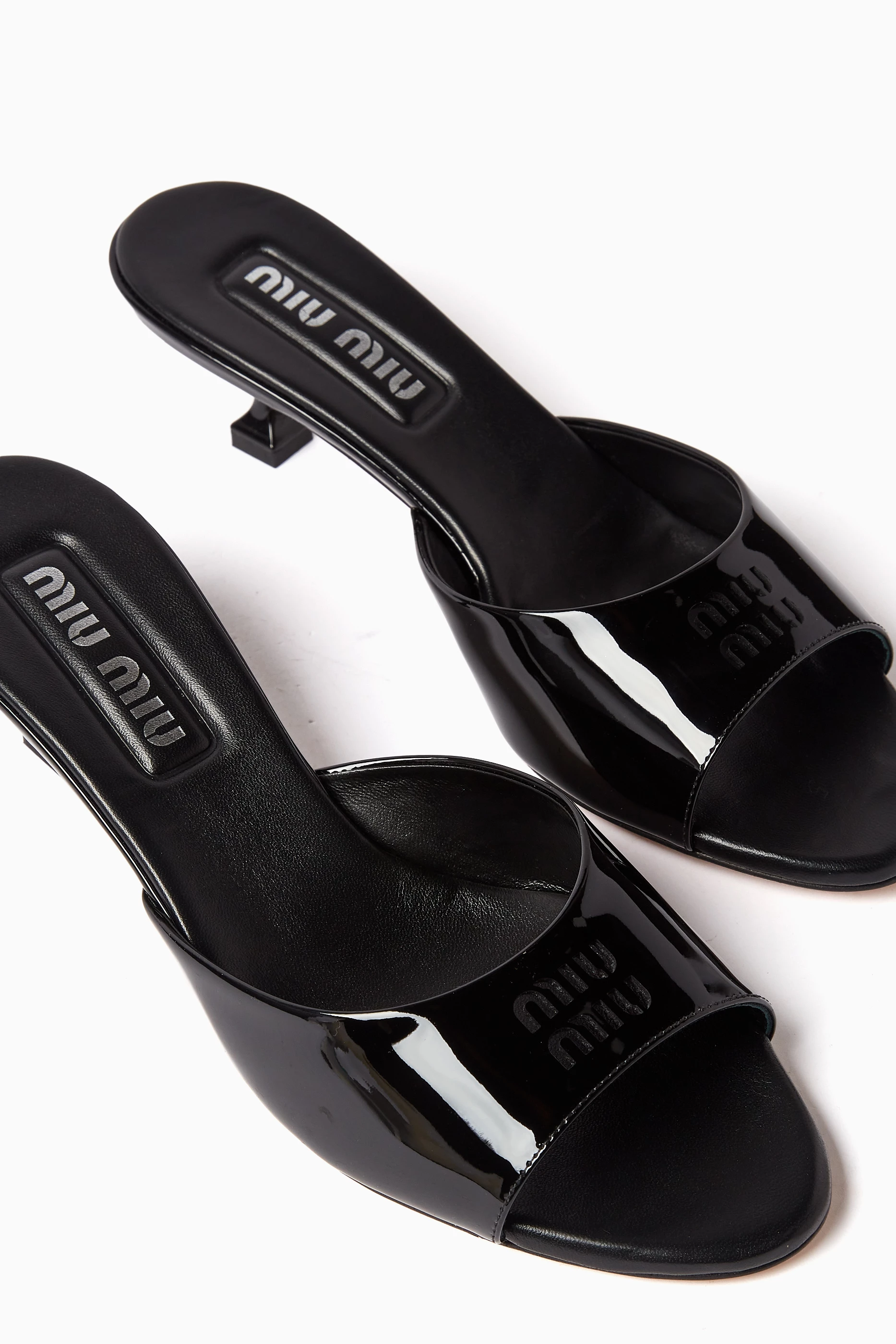 Buy Miu Miu Black Perforated Logo 45 Mules in Patent Leather