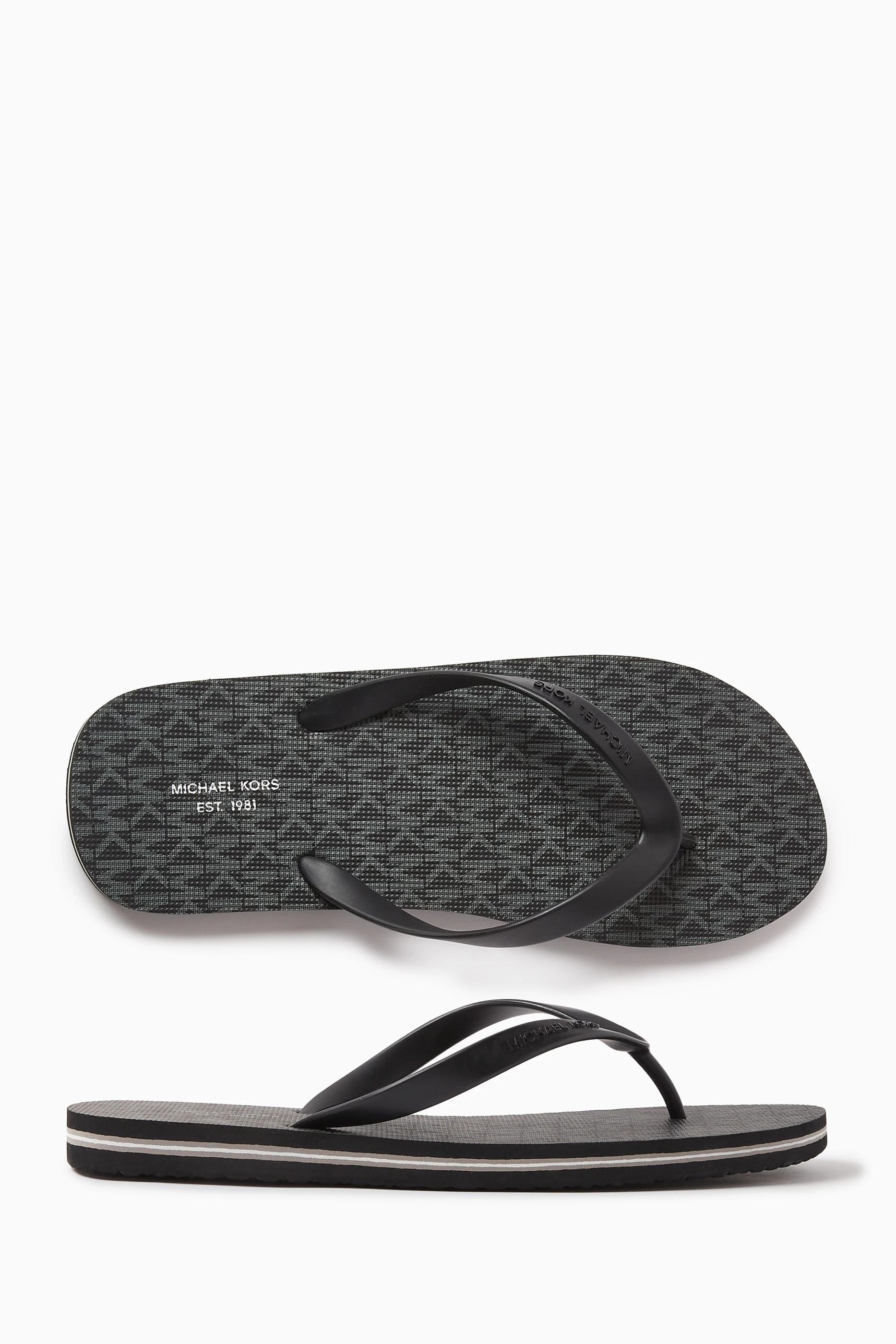 Buy Michael Kors Black Travis Flip Flops in Rubber For Men Online Ounass Saudi