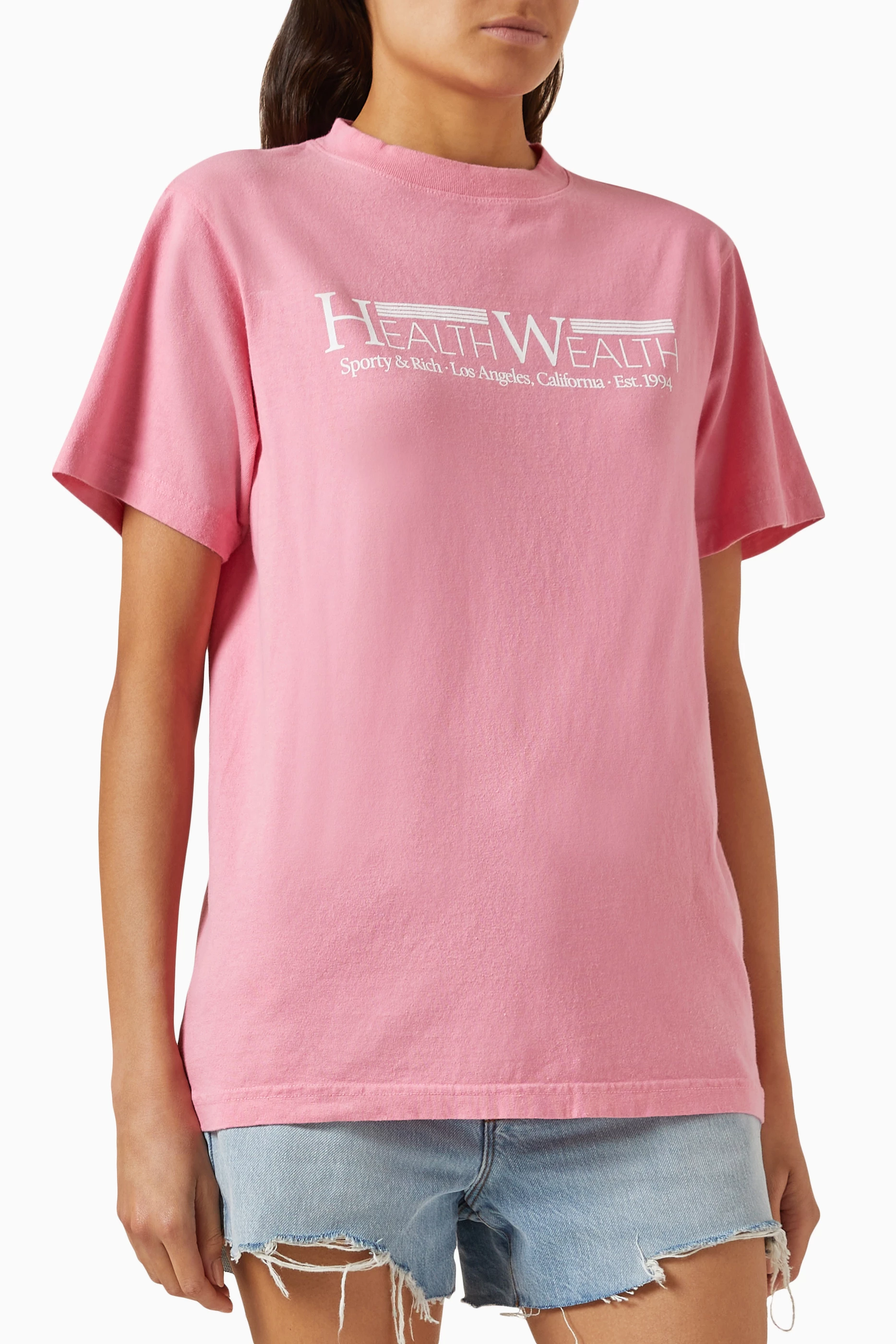 【関税込み】Sporty & Rich ピンク Health Wealth 94 Tシャツ Buy Sporty & Rich Pink Health Wealth 94 T-shirt in Cotton