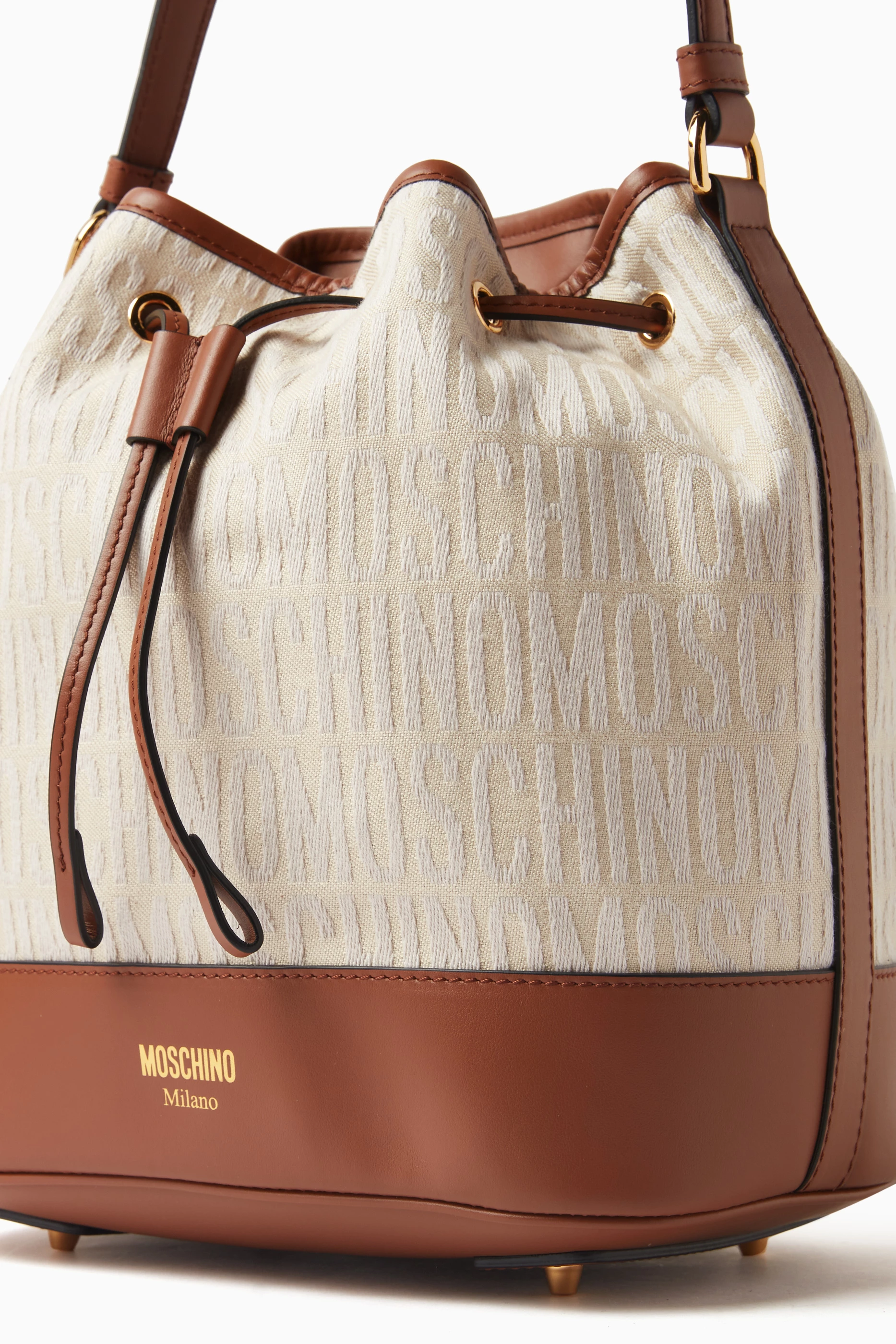 Buy Moschino Neutral Medium Logo Bucket Bag in Canvas Leather For Women Online Ounass Saudi