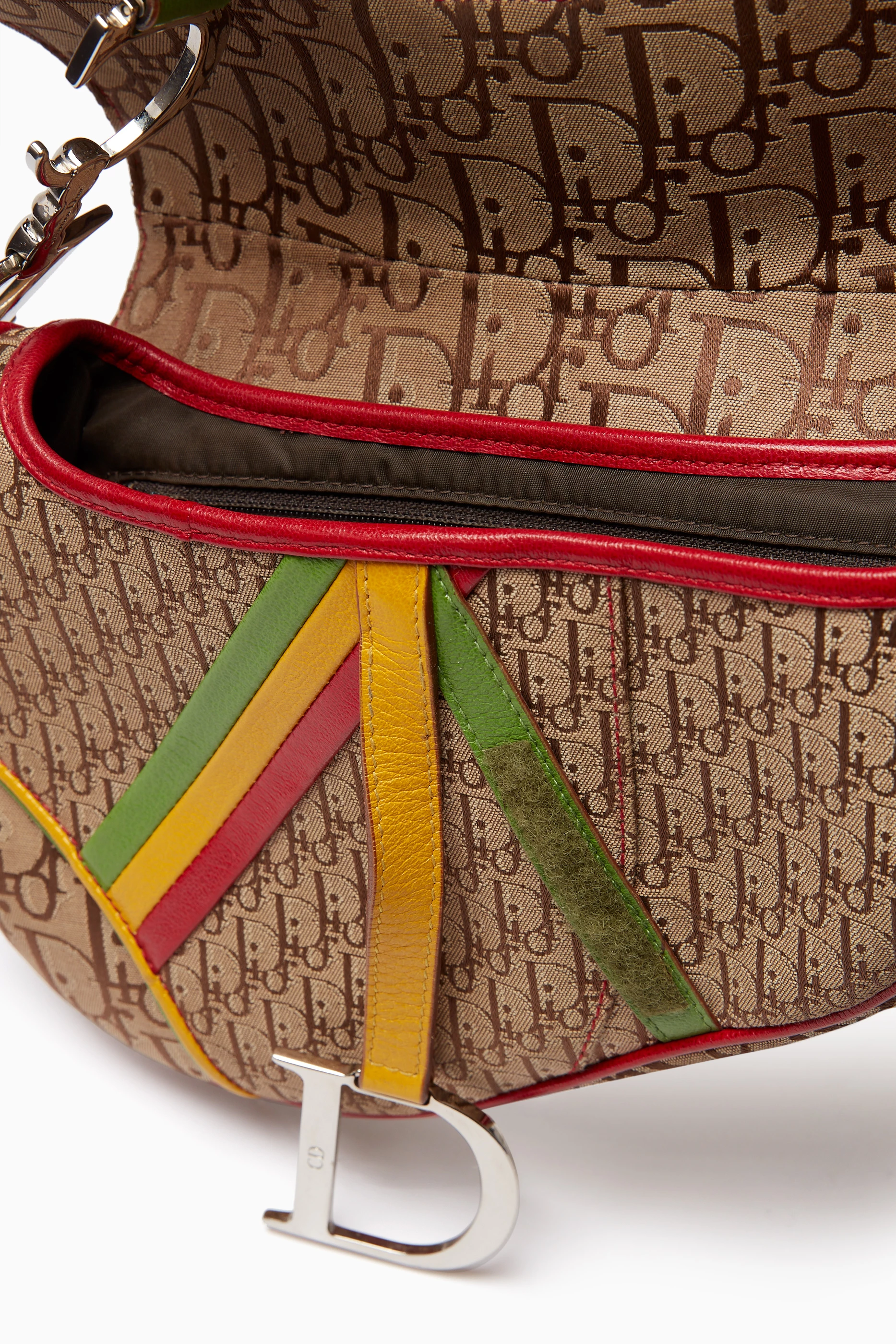 Buy Christian Dior Pre Loved Brown Galliano Rasta print Saddle Bag in Canvas Leather For Women Online Ounass Saudi