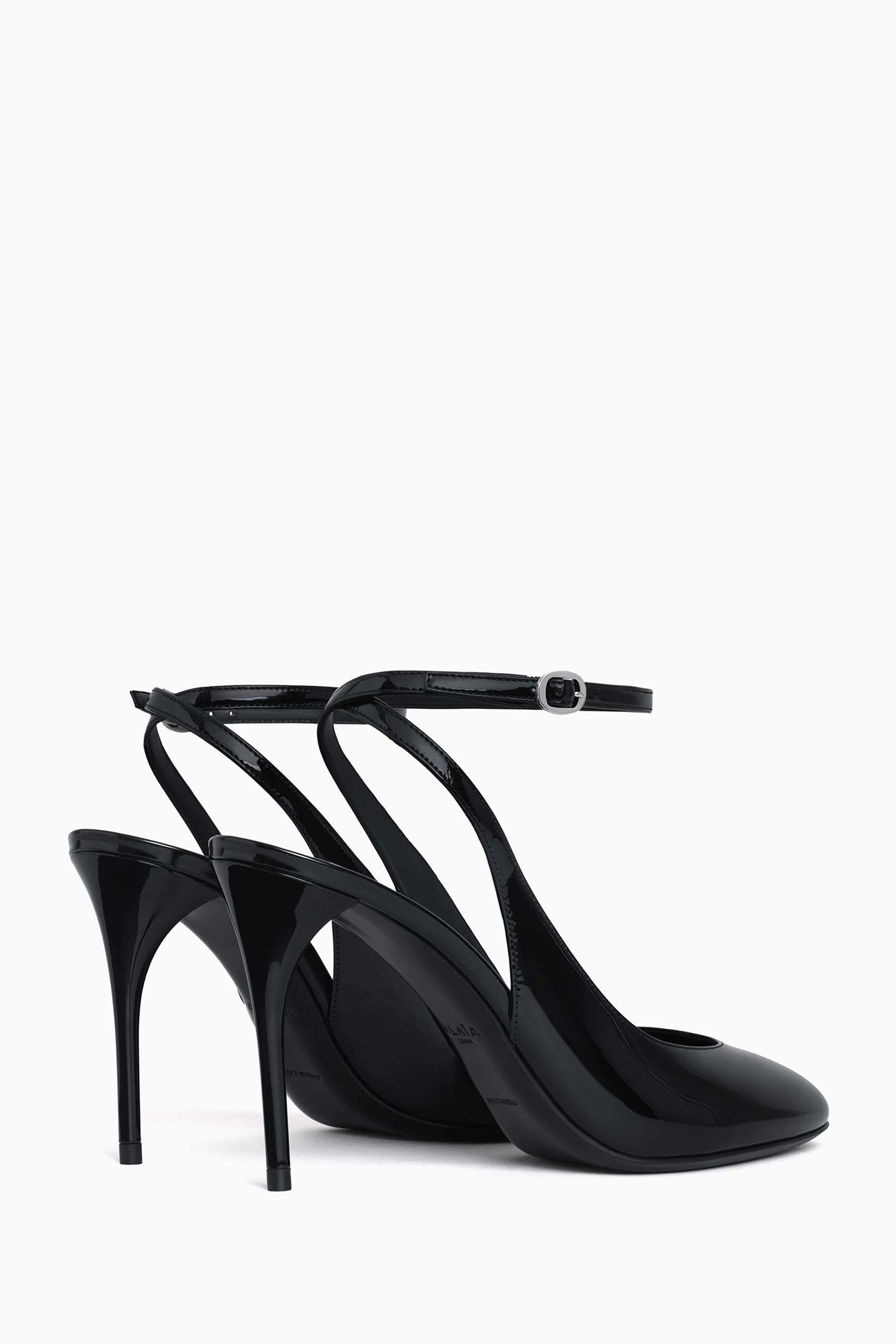 Buy Alaïa Black Décolleté 90 Slingback Pumps in Patent Leather For