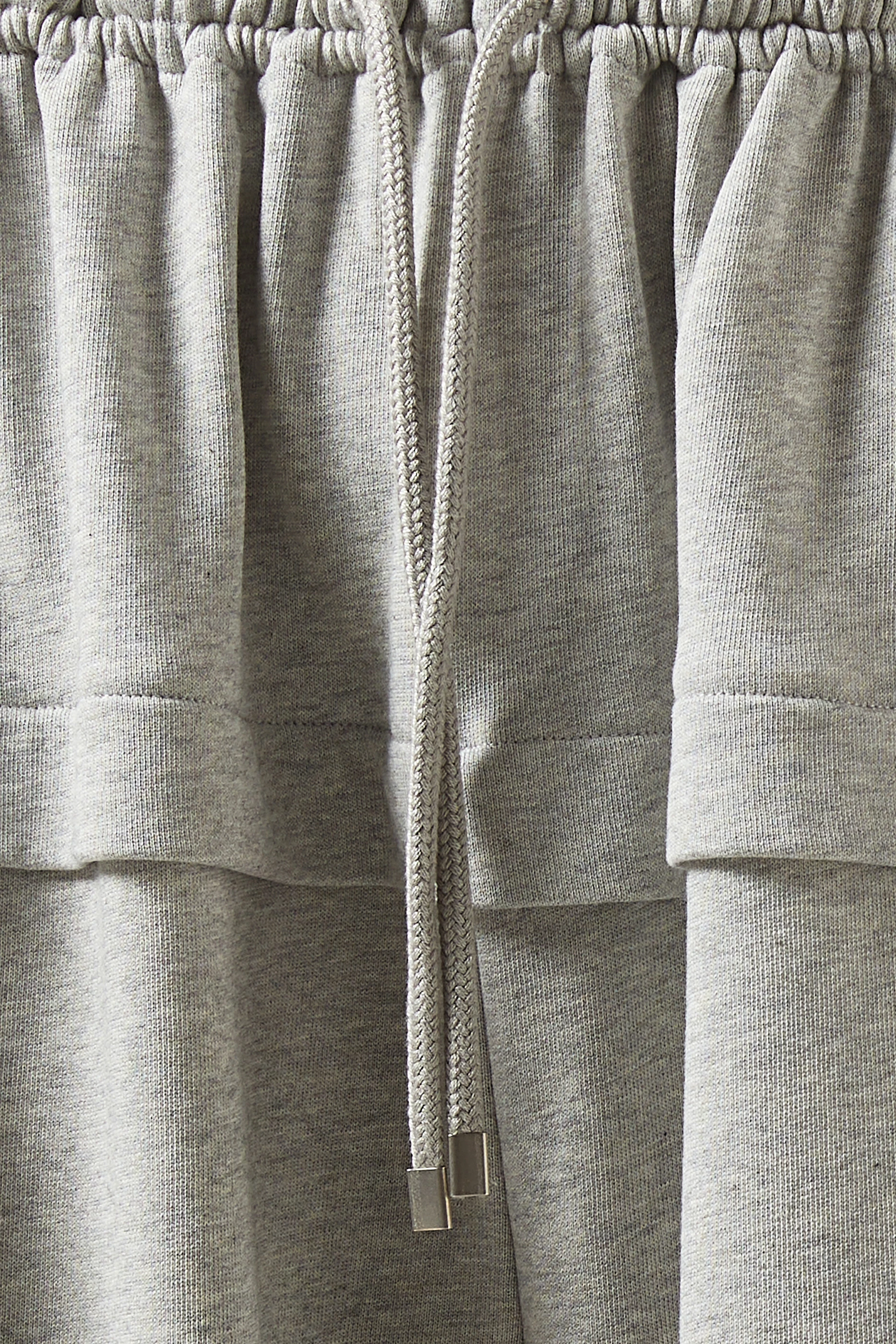 Buy Alaïa Grey Peplum Pants in Cotton Blend For Women Online