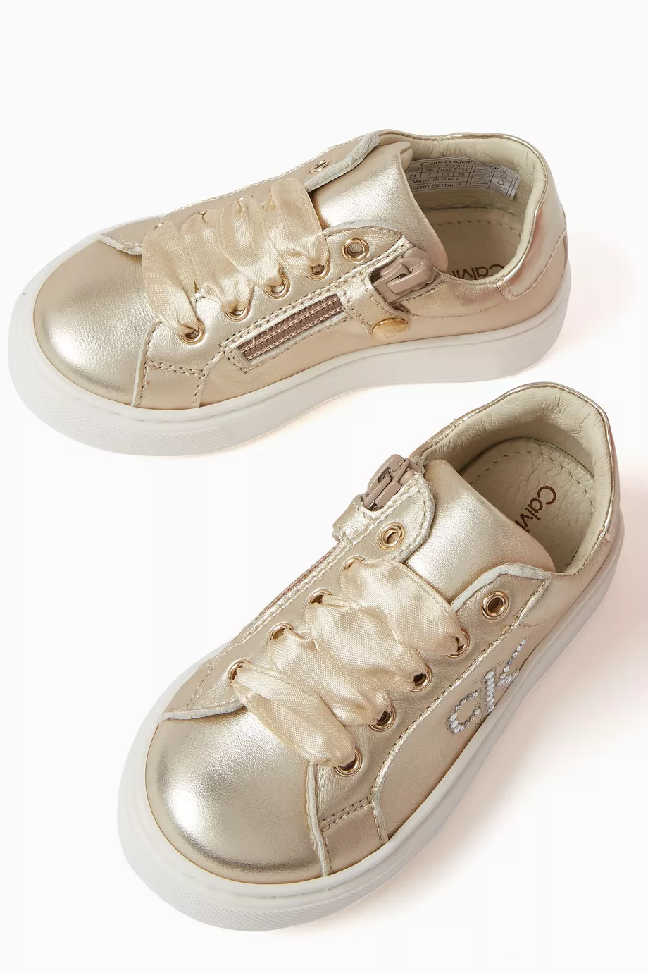 Buy Calvin Klein Gold Logo Lace up Sneakers in Metallic leather For Girls Online Ounass Saudi
