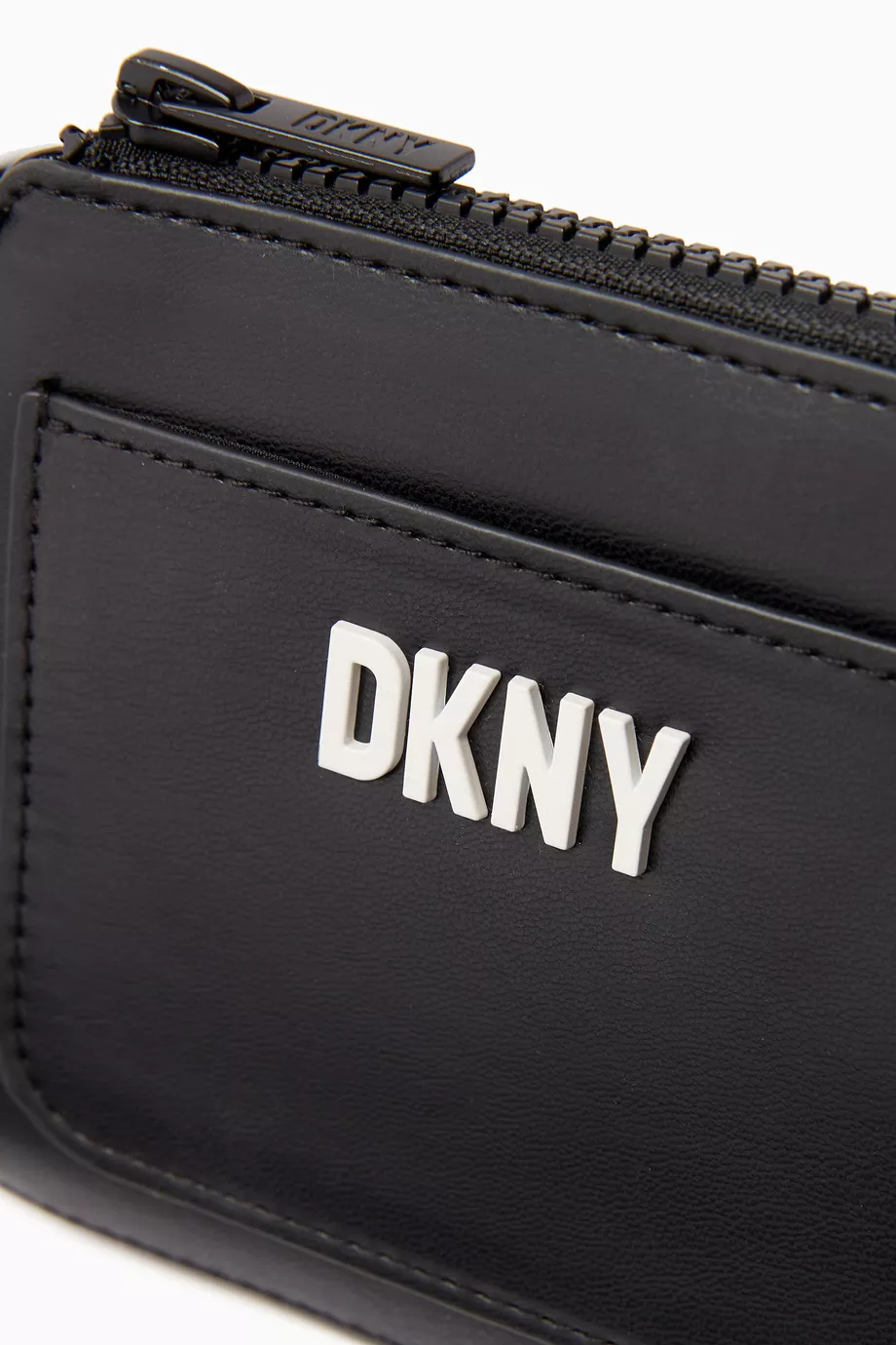 Buy DKNY Black Logo embossed Crossbody Bag in Faux Leather For Girls Online Ounass Saudi