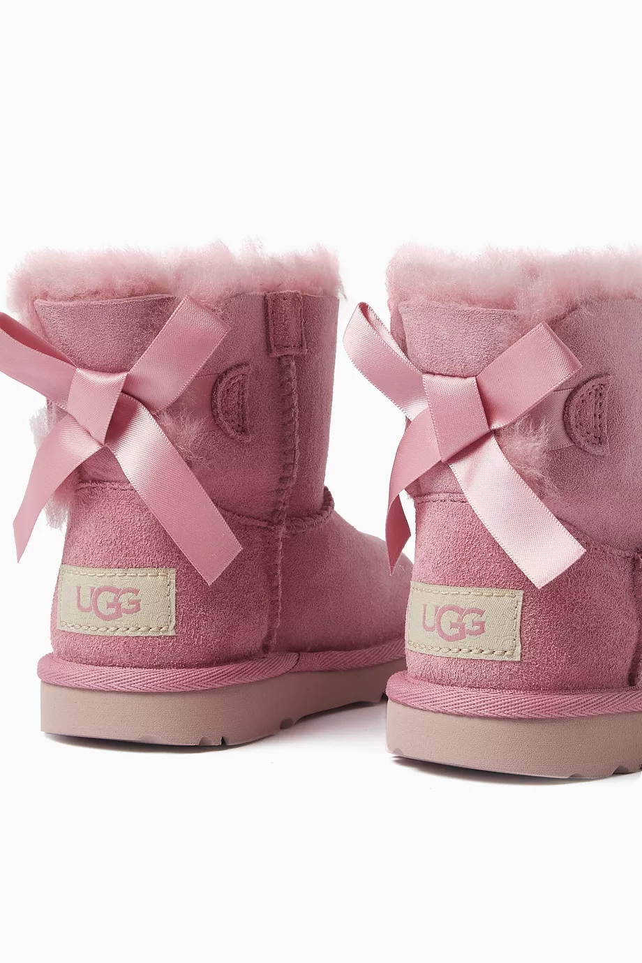 Pink mini bailey bow uggs hotsell