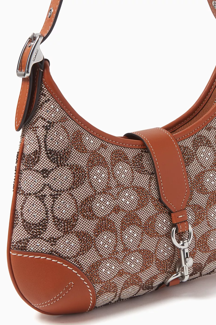 Buy Coach Brown Hamptons Hobo Bag in Crystal Signature Jacquard For Women Online Ounass Saudi